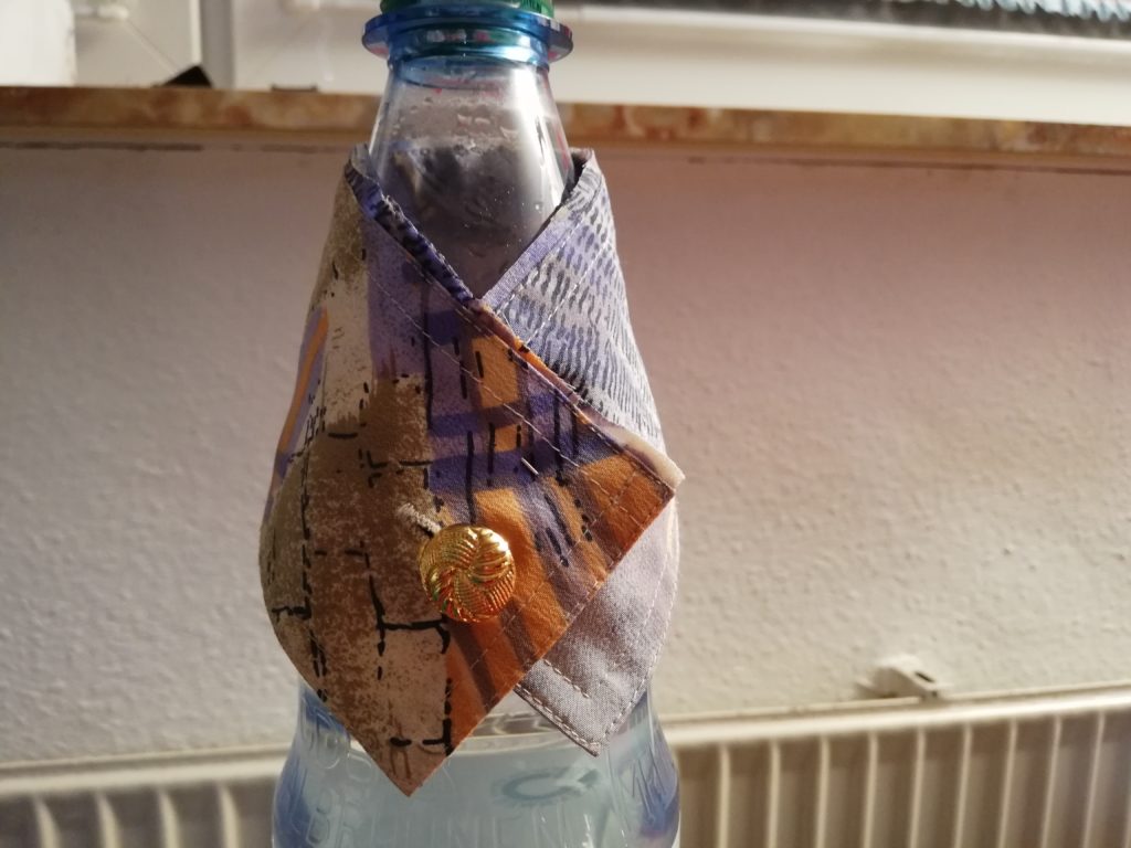 Manschette als Verpackung für Flaschen